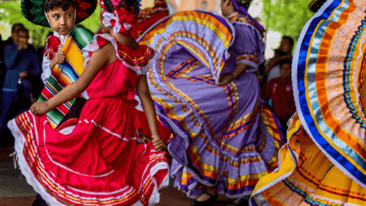 Mexican flags and dancers celebrating Cinco de Mayo in Puebla, Mexico