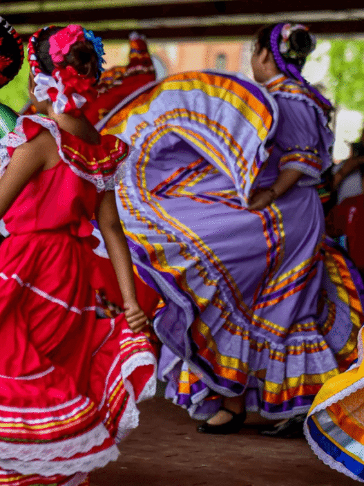 Mexican flags and dancers celebrating Cinco de Mayo in Puebla, Mexico