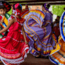 Mexican flags and dancers celebrating Cinco de Mayo in Puebla, Mexico
