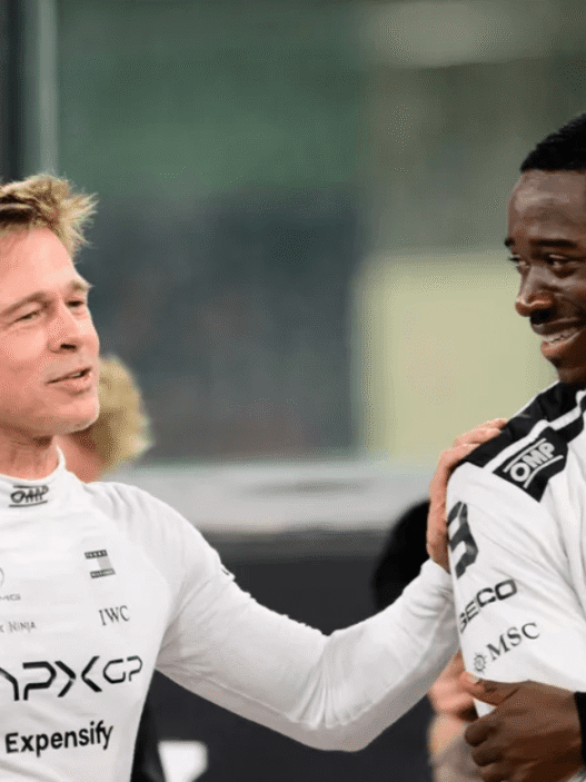 Damson Idris revealing Tommy Hilfiger tuxedo under F1 racing suit at 2025 Met Gala
