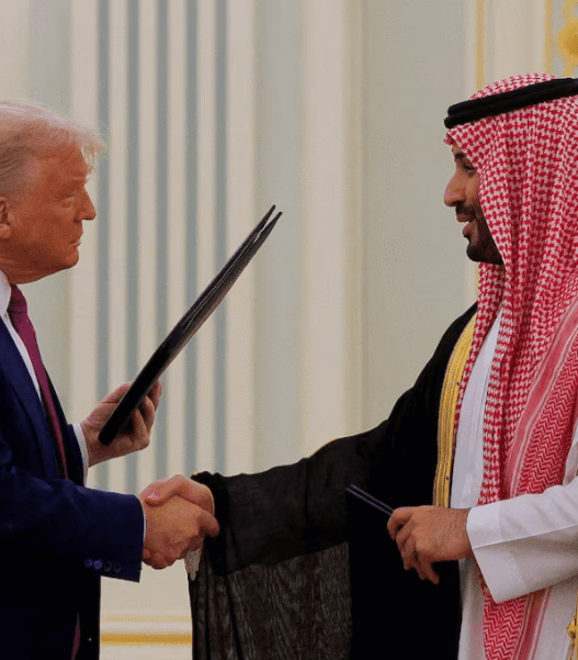 Donald Trump and Crown Prince Mohammed bin Salman shake hands in Riyadh after announcing a $600B U.S.-Saudi investment and arms agreement.