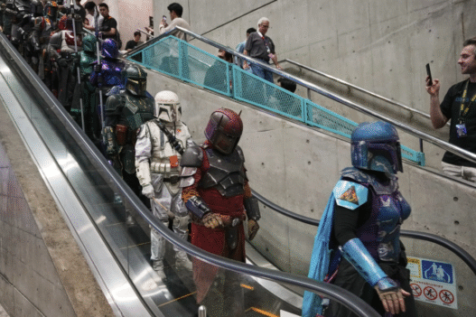 Stormtroopers and fans dressed in Star Wars costumes celebrating May the 4th, also known as Star Wars Day.