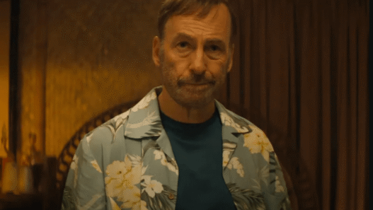 Bob Odenkirk as Hutch Mansell wielding a mallet in a violent action scene from the Nobody 2 trailer.