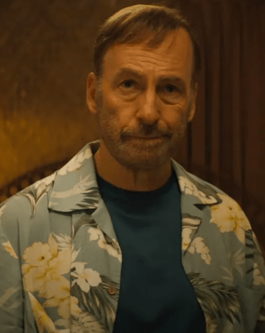 Bob Odenkirk as Hutch Mansell wielding a mallet in a violent action scene from the Nobody 2 trailer.