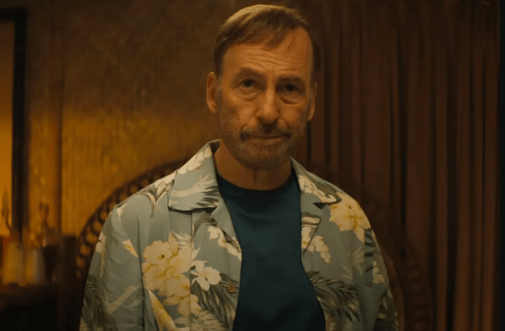 Bob Odenkirk as Hutch Mansell wielding a mallet in a violent action scene from the Nobody 2 trailer.