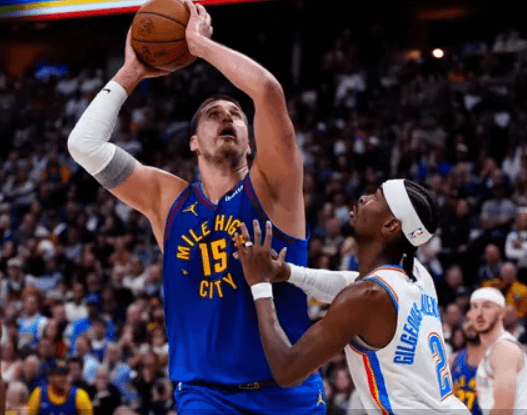 Shai Gilgeous-Alexander drives past Nikola Jokić during the 2025 NBA Playoffs as MVP rumors swirl.