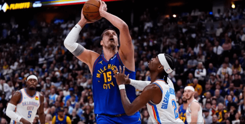 Shai Gilgeous-Alexander drives past Nikola Jokić during the 2025 NBA Playoffs as MVP rumors swirl.