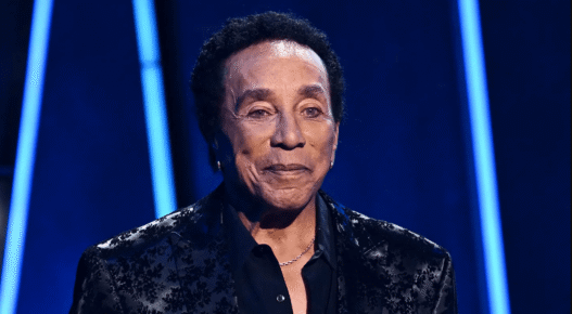 Smokey Robinson and his wife Frances Robinson at a public event, amid new sexual assault lawsuit allegations from former employees.
