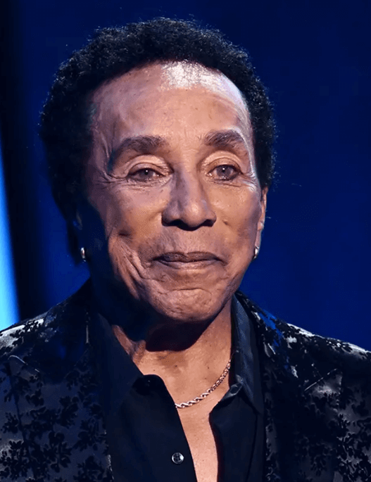 Smokey Robinson and his wife Frances Robinson at a public event, amid new sexual assault lawsuit allegations from former employees.
