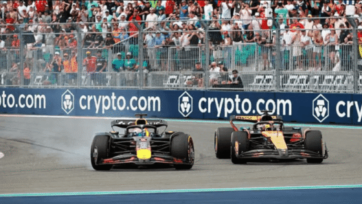 Oscar Piastri celebrates winning the Miami Grand Prix in his McLaren F1 car.