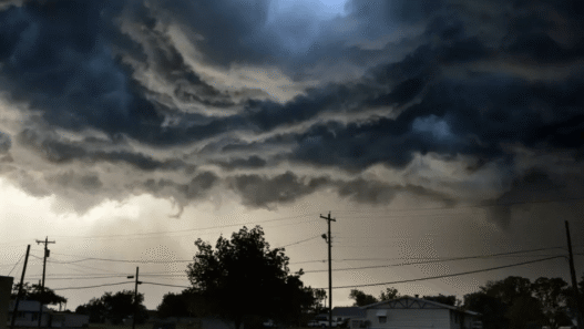 Dark storm clouds gather over Texas Hill Country as NWS issues tornado and severe thunderstorm warnings.