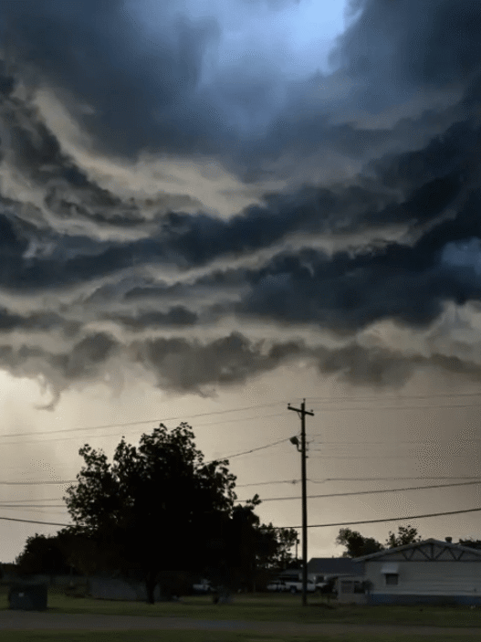 Dark storm clouds gather over Texas Hill Country as NWS issues tornado and severe thunderstorm warnings.