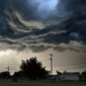 Dark storm clouds gather over Texas Hill Country as NWS issues tornado and severe thunderstorm warnings.
