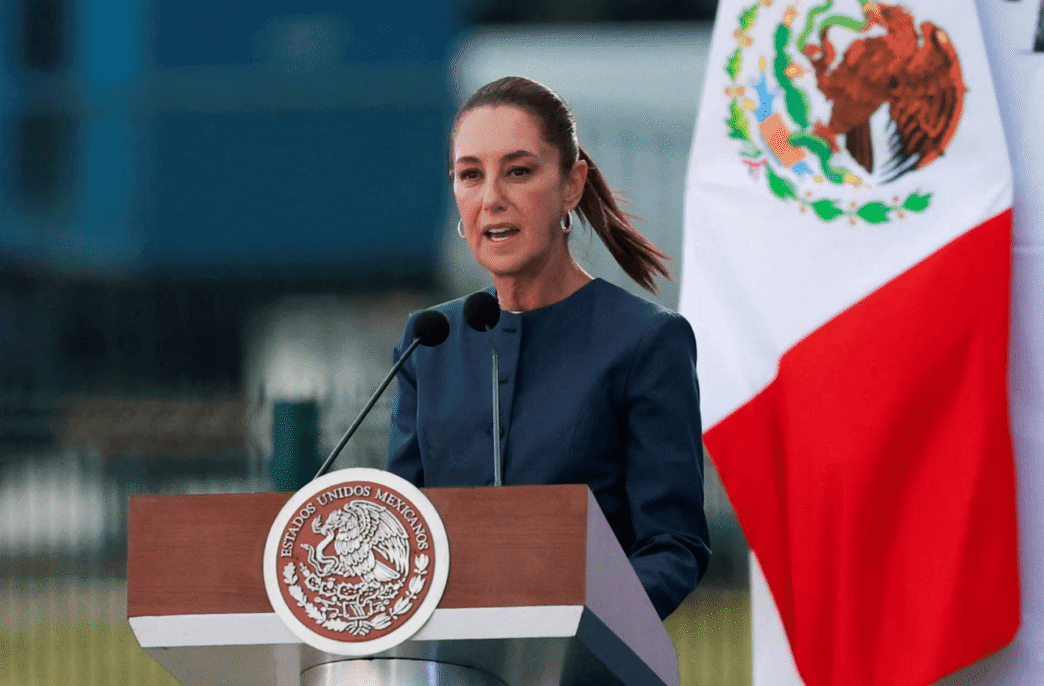 Mexican President Claudia Sheinbaum speaking at a podium during a press conference