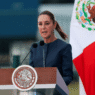 Mexican President Claudia Sheinbaum speaking at a podium during a press conference