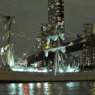 Mexican Navy tall ship Cuauhtémoc with broken masts after striking the Brooklyn Bridge, with crew members visible in the rigging and emergency response underway.