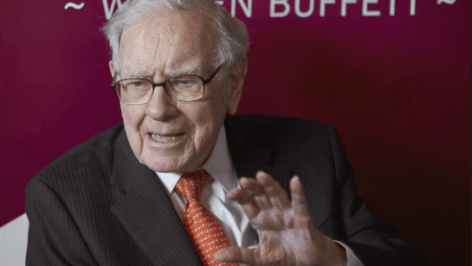 Buffett with Greg Abel at shareholder meeting.