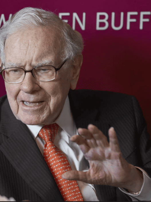 Buffett with Greg Abel at shareholder meeting.