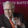 Buffett with Greg Abel at shareholder meeting.