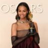 Zoe Saldaña Faces Backlash for Calling Her Oscar “Trans” and “They/Them” Without Speaking on